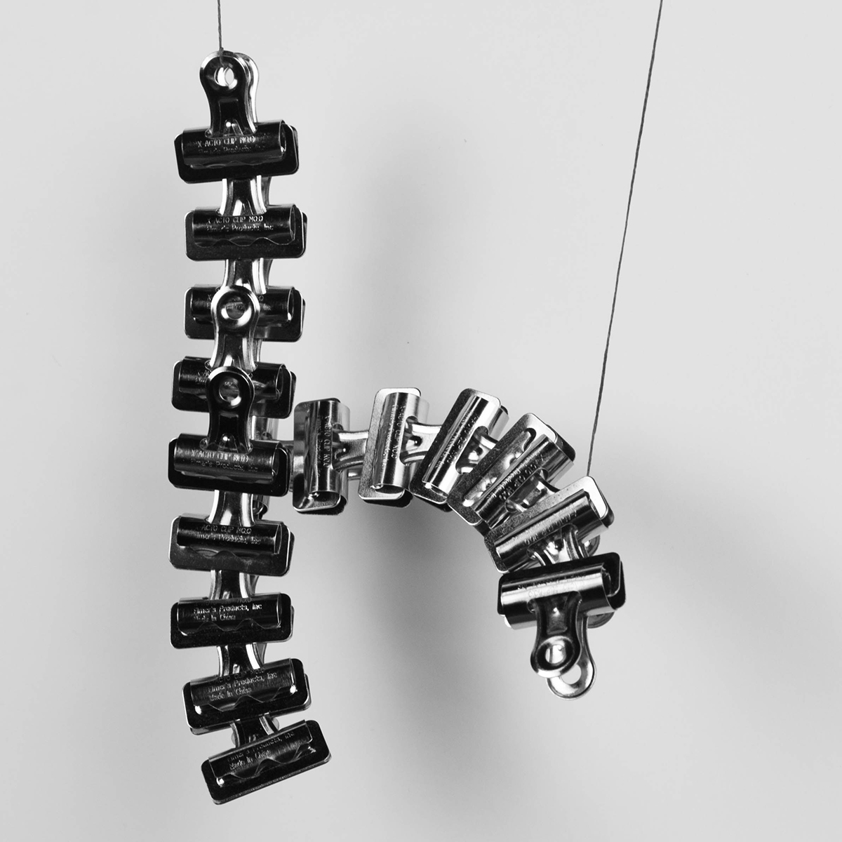 poster clips type lettering chrome b&w