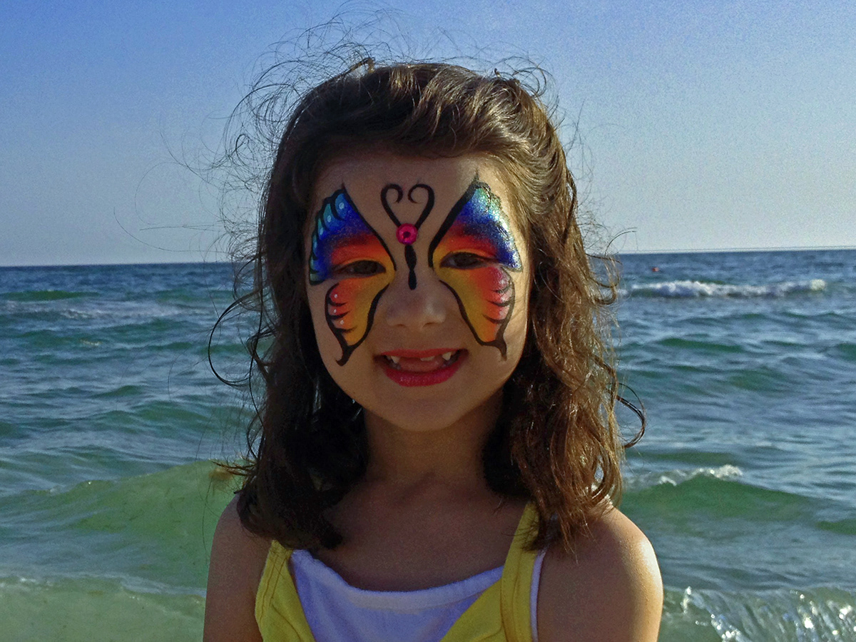 Ocean sea tide waves sea gull butterfly Face painting romantic getaway St. Pete Beach clouds SKY sunset