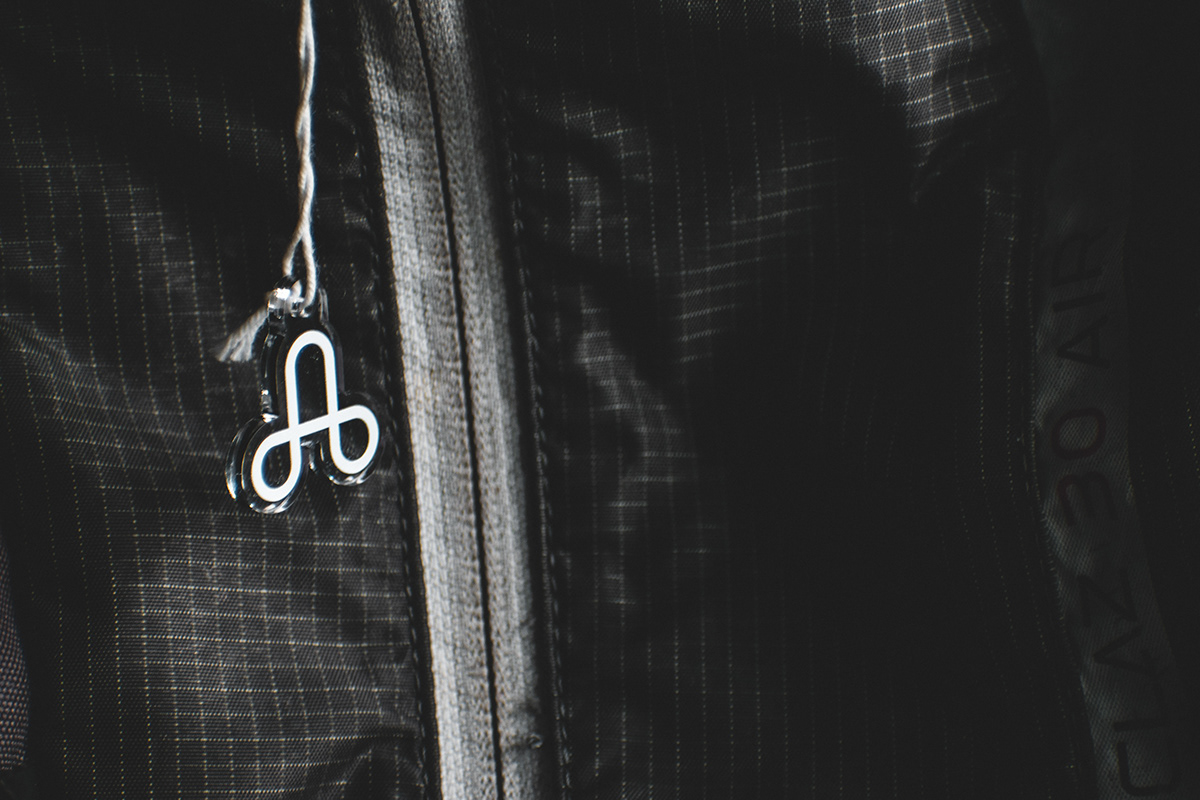 A close up photograph of the icon for The Uprising hanging from a backpack