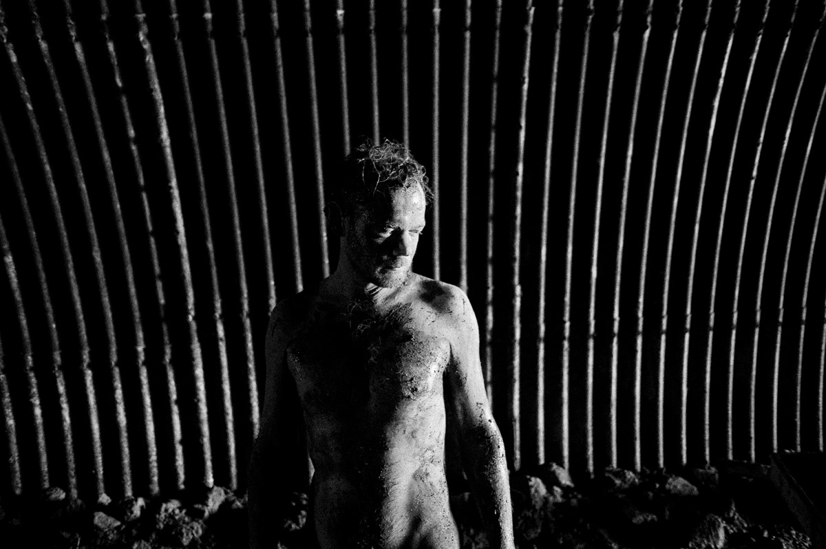 tunnel postmordium singapore mud man human light darkness evolution