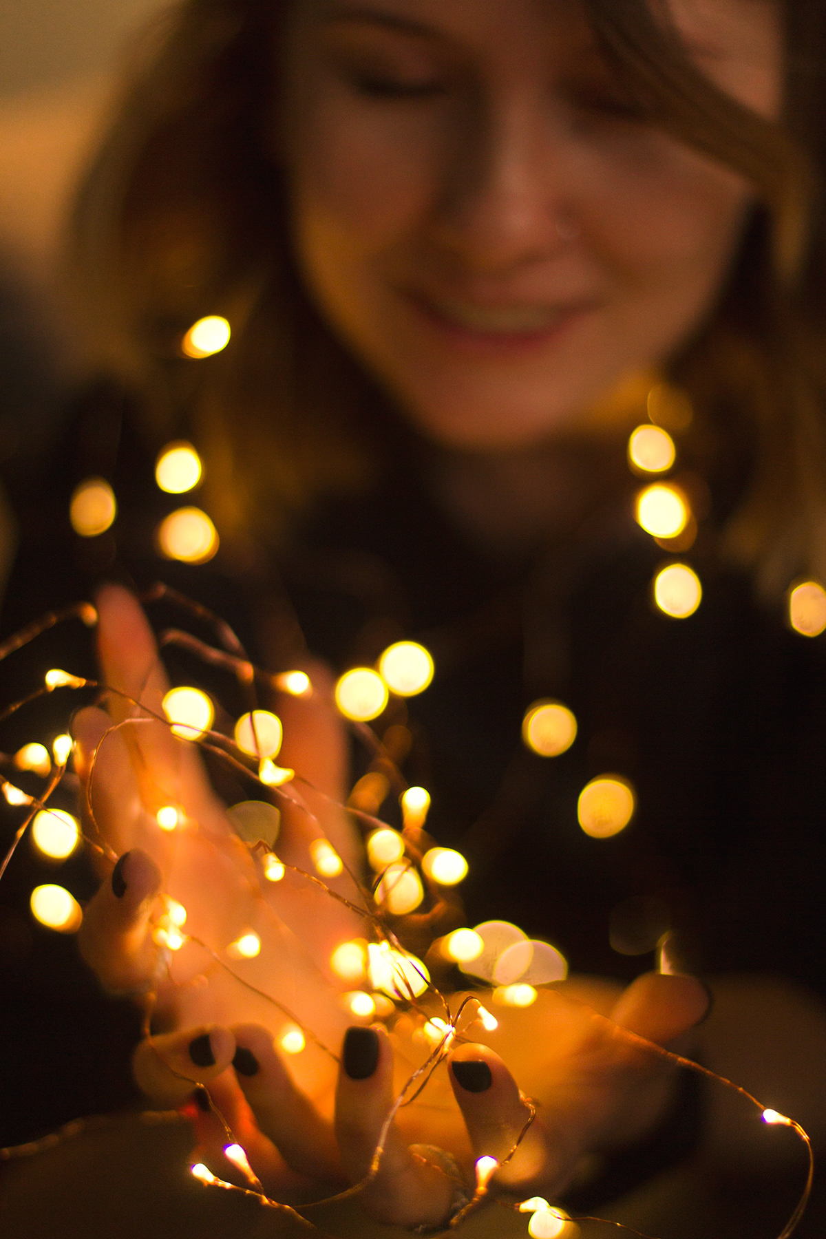 Christmas light girl smile portrait merry hands lights Canon 60D 50mm