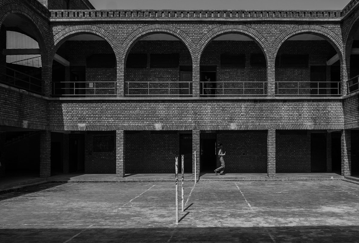 school shoot architecturalphotography brickwork design art exposed concrete arches courtyard minimal longexposure blackandwhite children