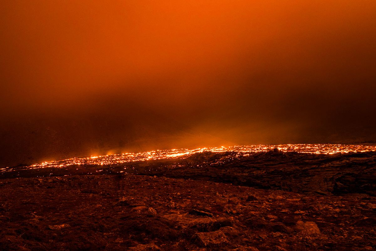 The nightly lava dips the landscape in an extraterrestrial orange