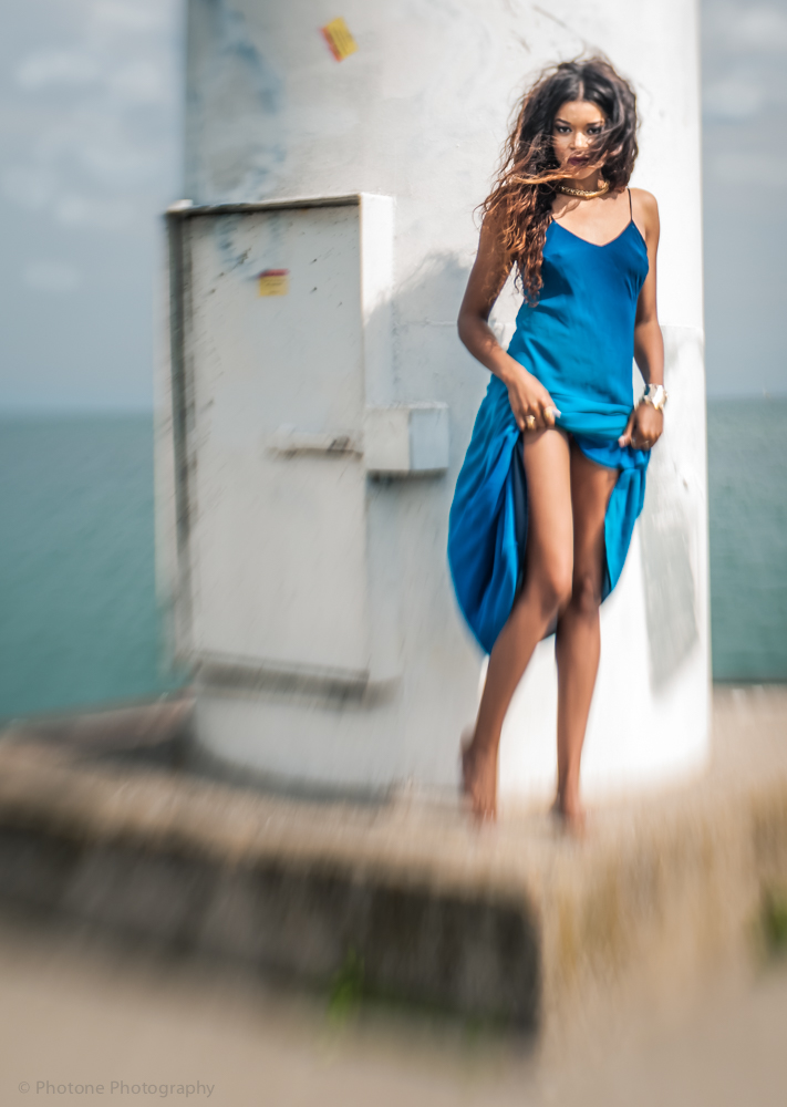 light tower sea lake water wind Outdoor black model blue dress lensbaby