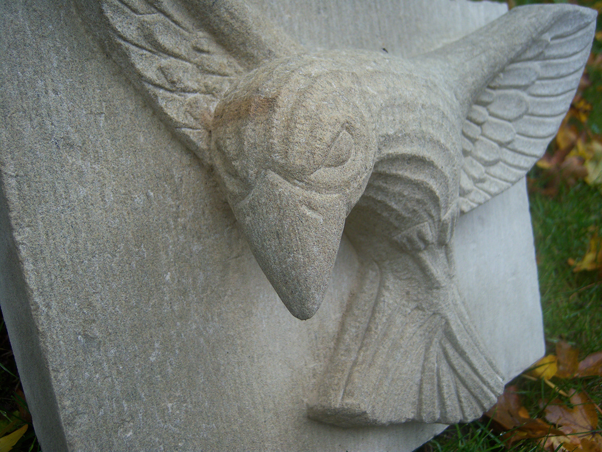 raven stone carving relief