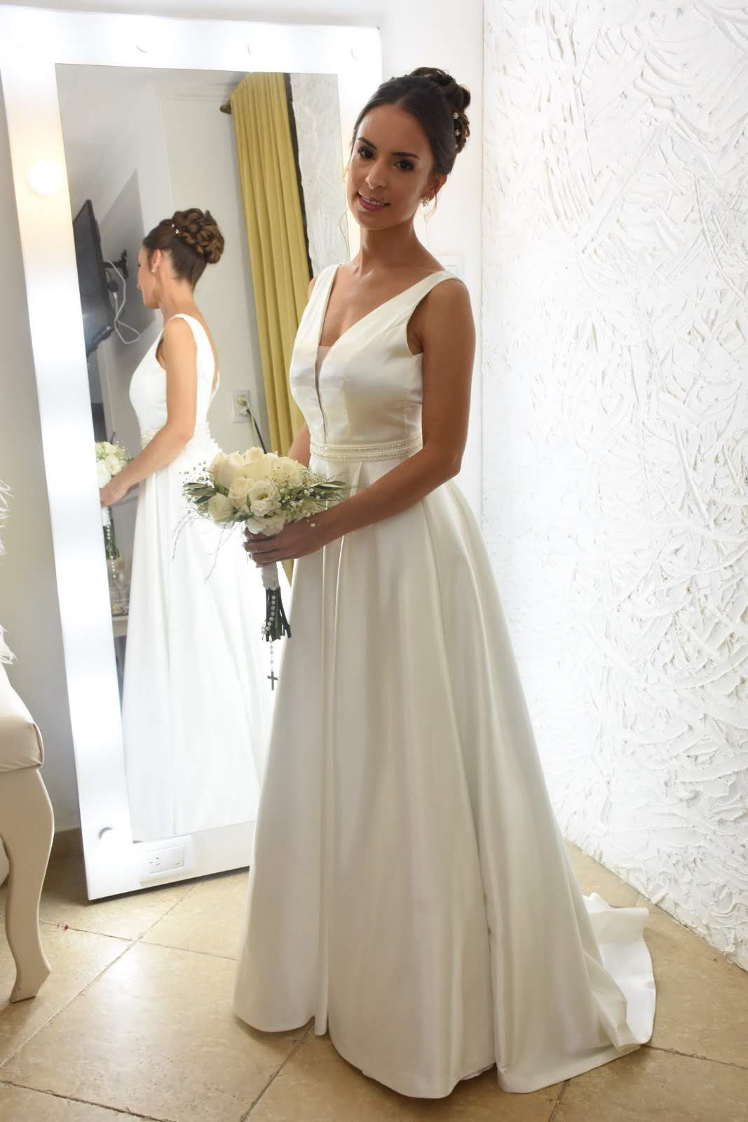 Image may contain: wall, wedding dress and bride