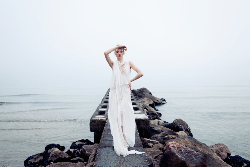 bride clothes styling  model woman White bridal wedding sea winter fog Melancholy emotion emotive portrait movement