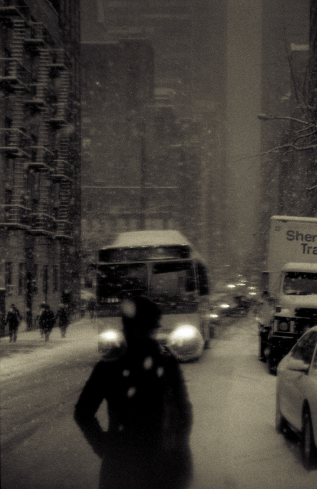 A person walking in the snow in New York.