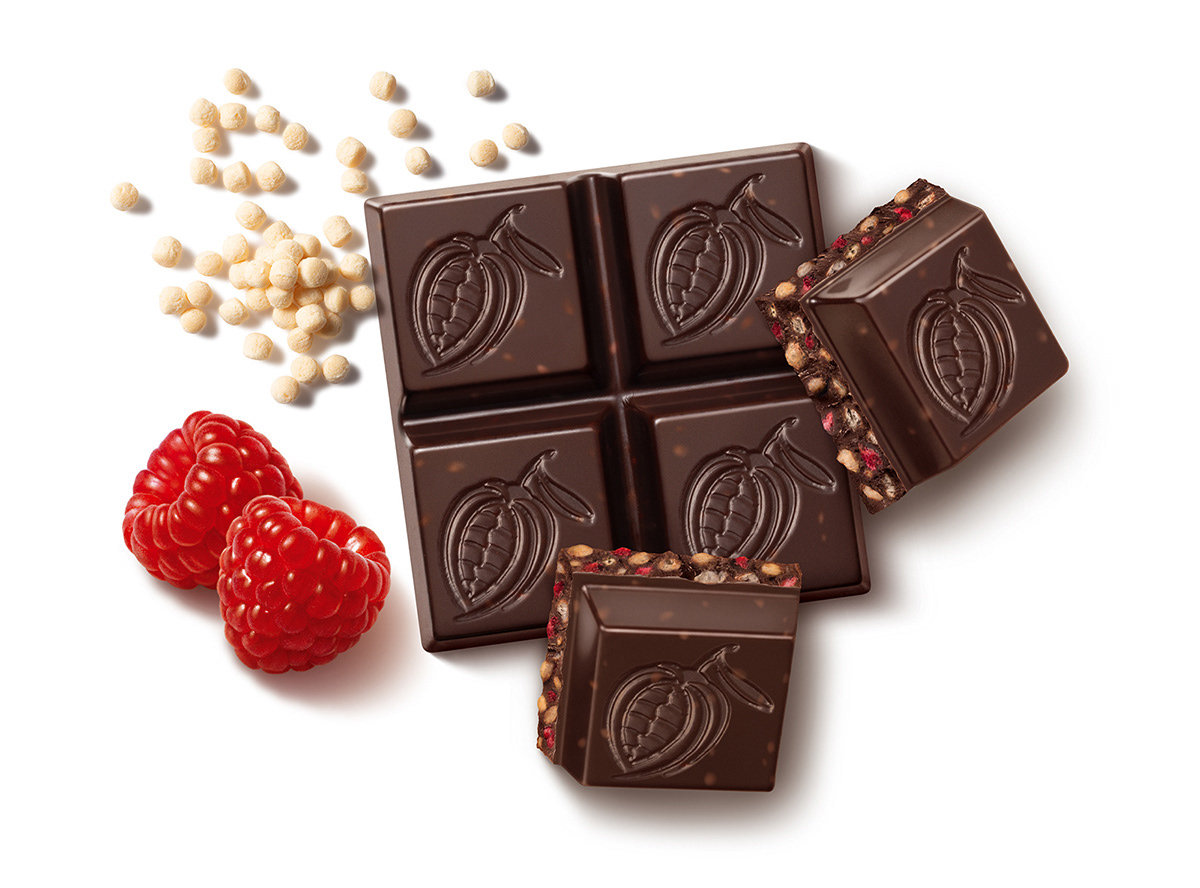 Dark chocolate Chocxo Snaps with fruit and nut fillings for product packaging and advertising.