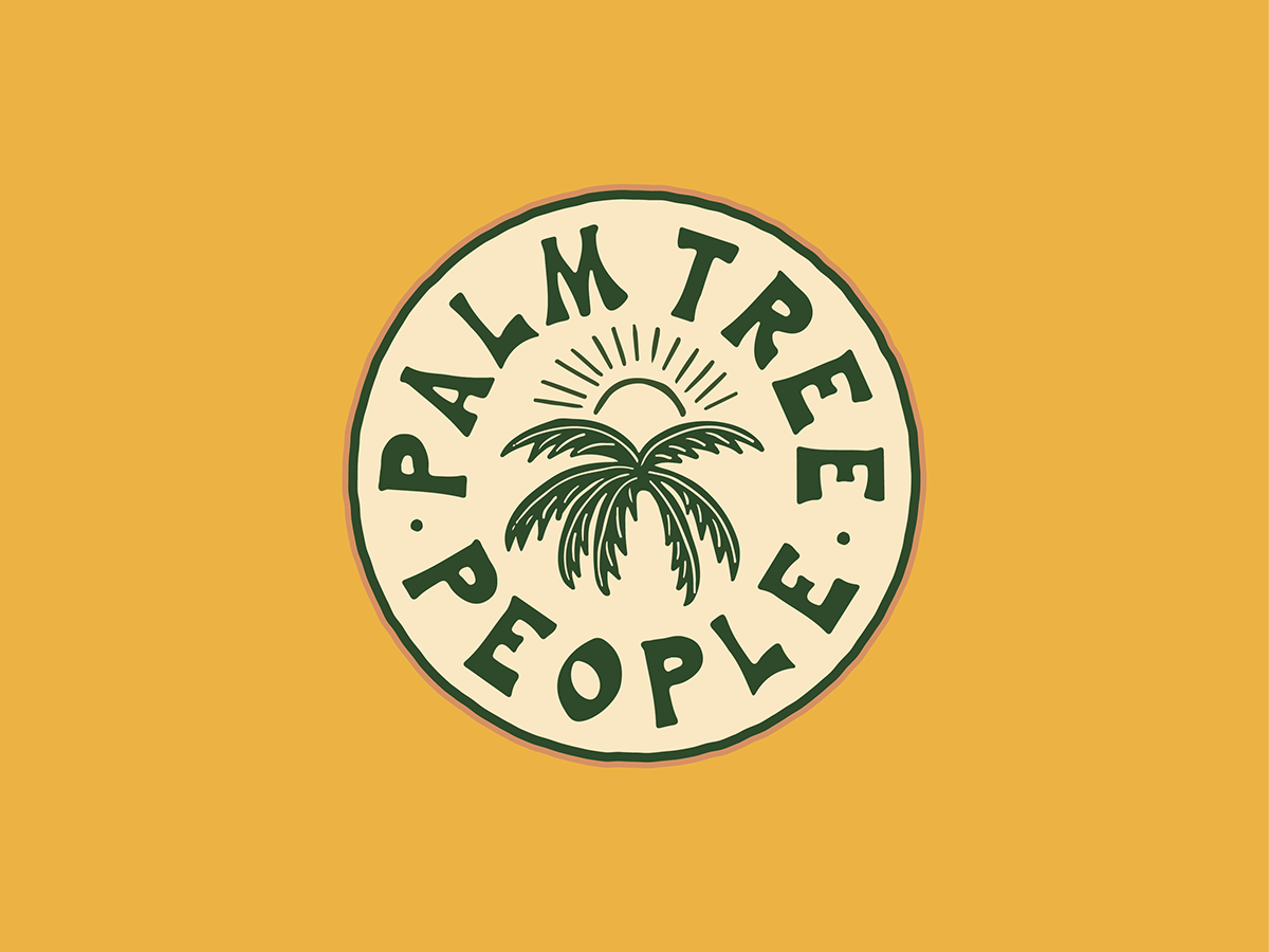 circular logo with palm tree and sun