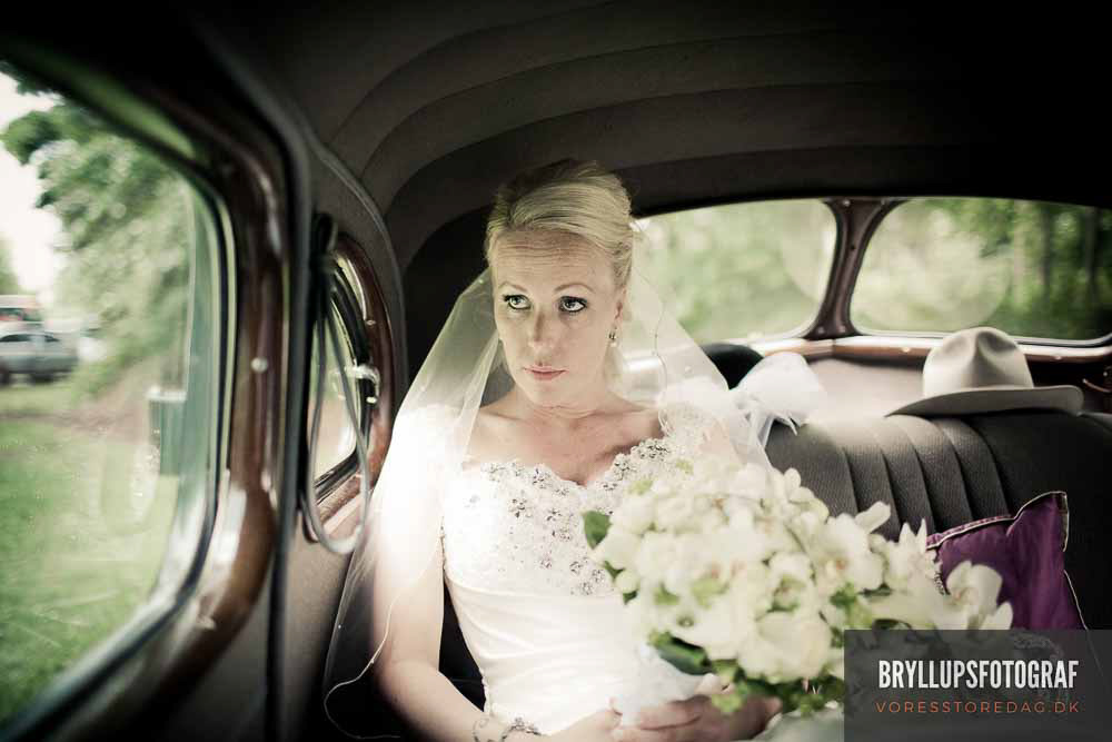 Image may contain: car, wedding dress and bride