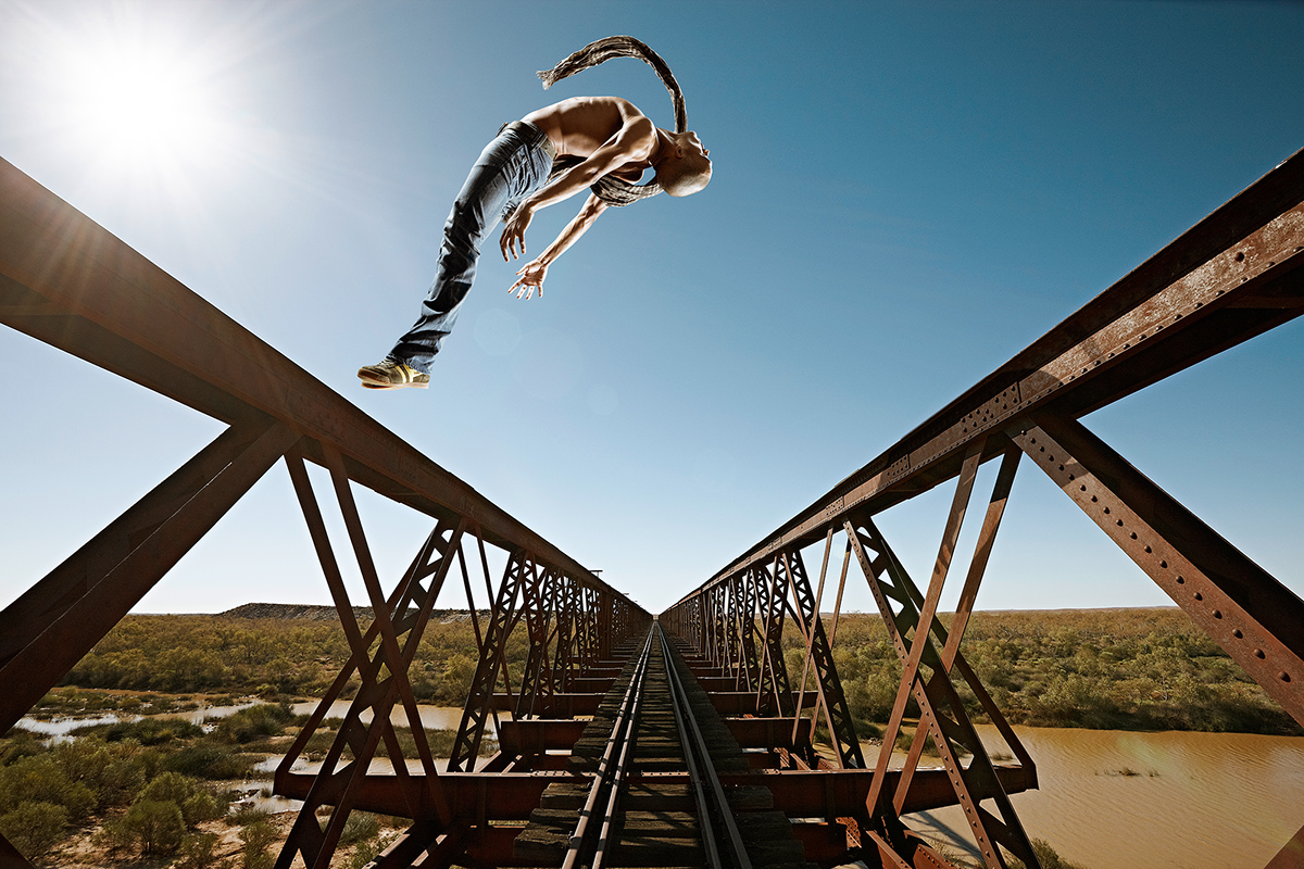 Coober Pedy outback Australia desert dancing jumping car wreck rusty railway track old Aborigines sunshine blue sky
