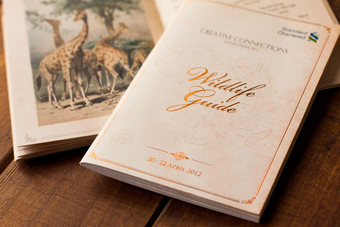 leather folder Event Branding  Packaging Design  book design singapore  Africa  emboss  vintage  foil stamp animal illustrations