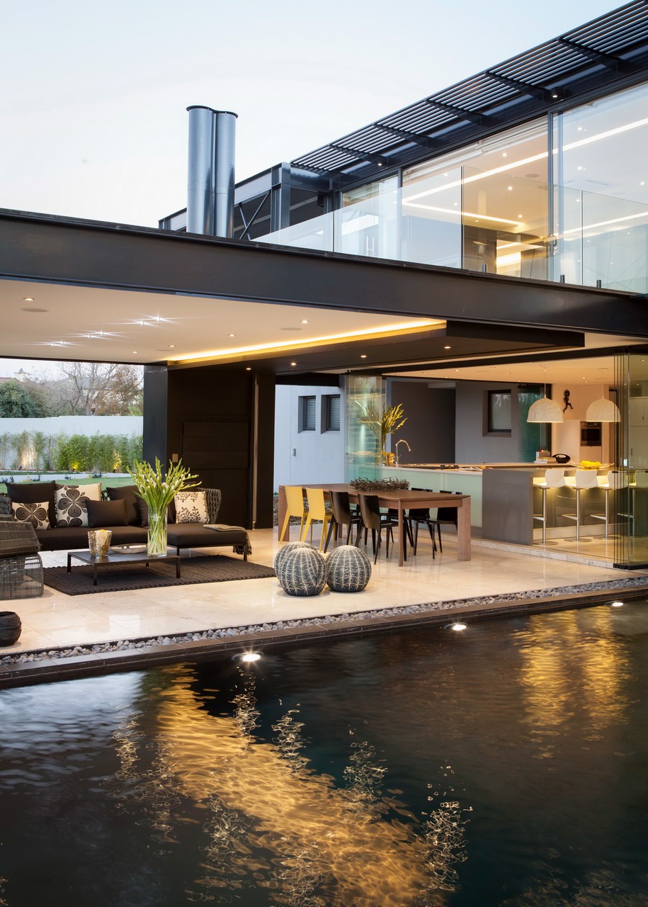water features contemporary glass house Cantilever steel double volume open plan architectural design lanai indoor-outdoor contemporary architecture INTERNATIONAL ARCHITECTS floating staircase structure house home