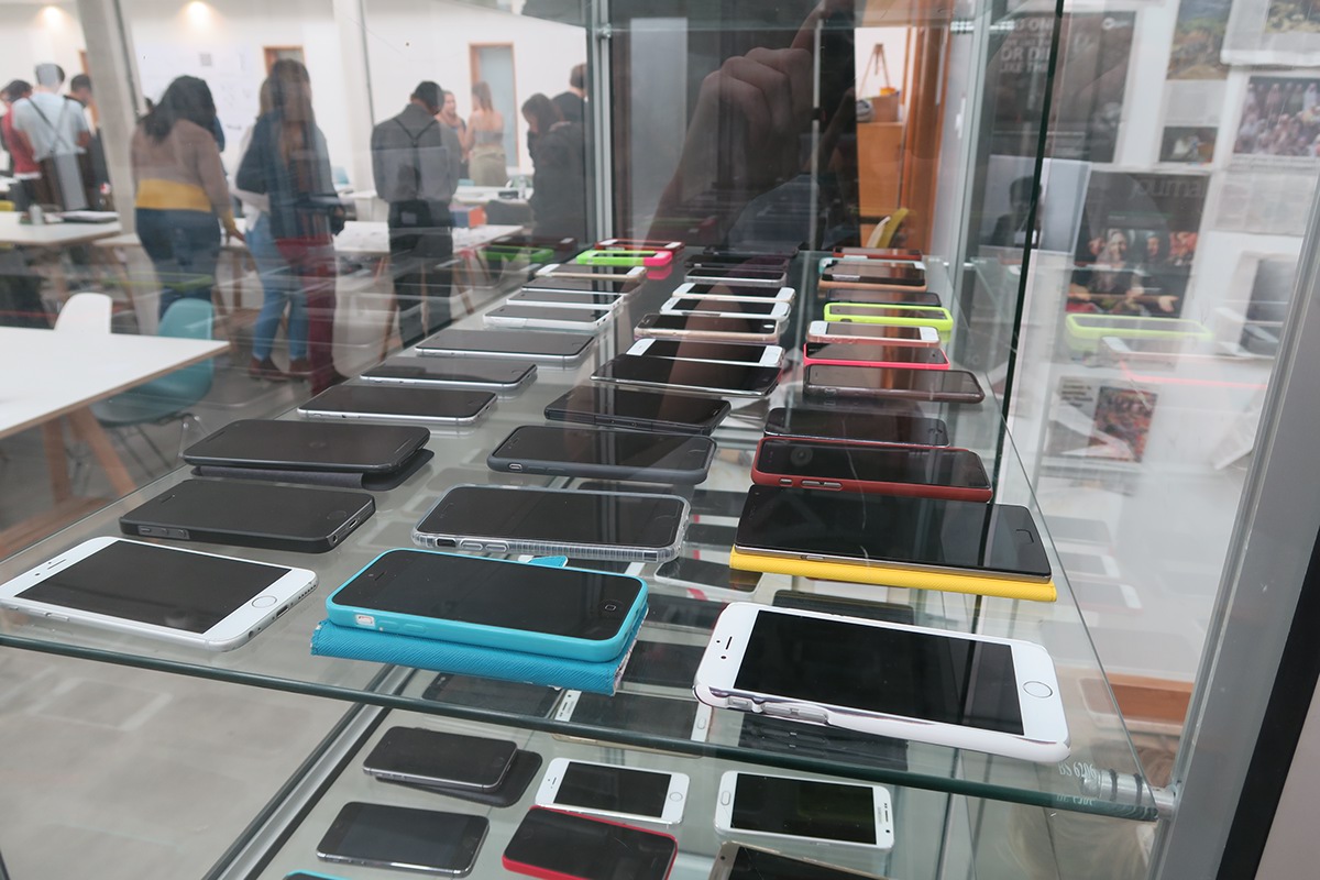 mobile phones locked in a glass cabinet for a social experiment at falmouth university