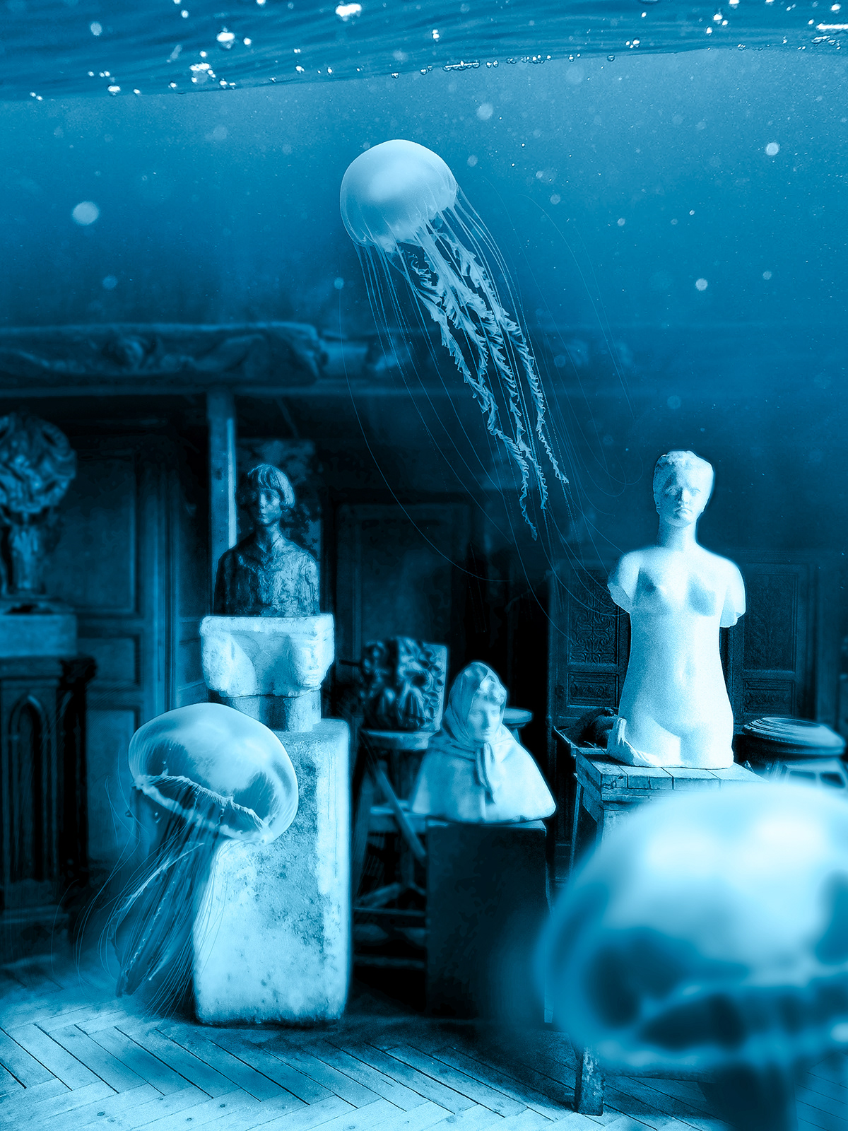 A underwater scene with some statues and jellyfishes around it.