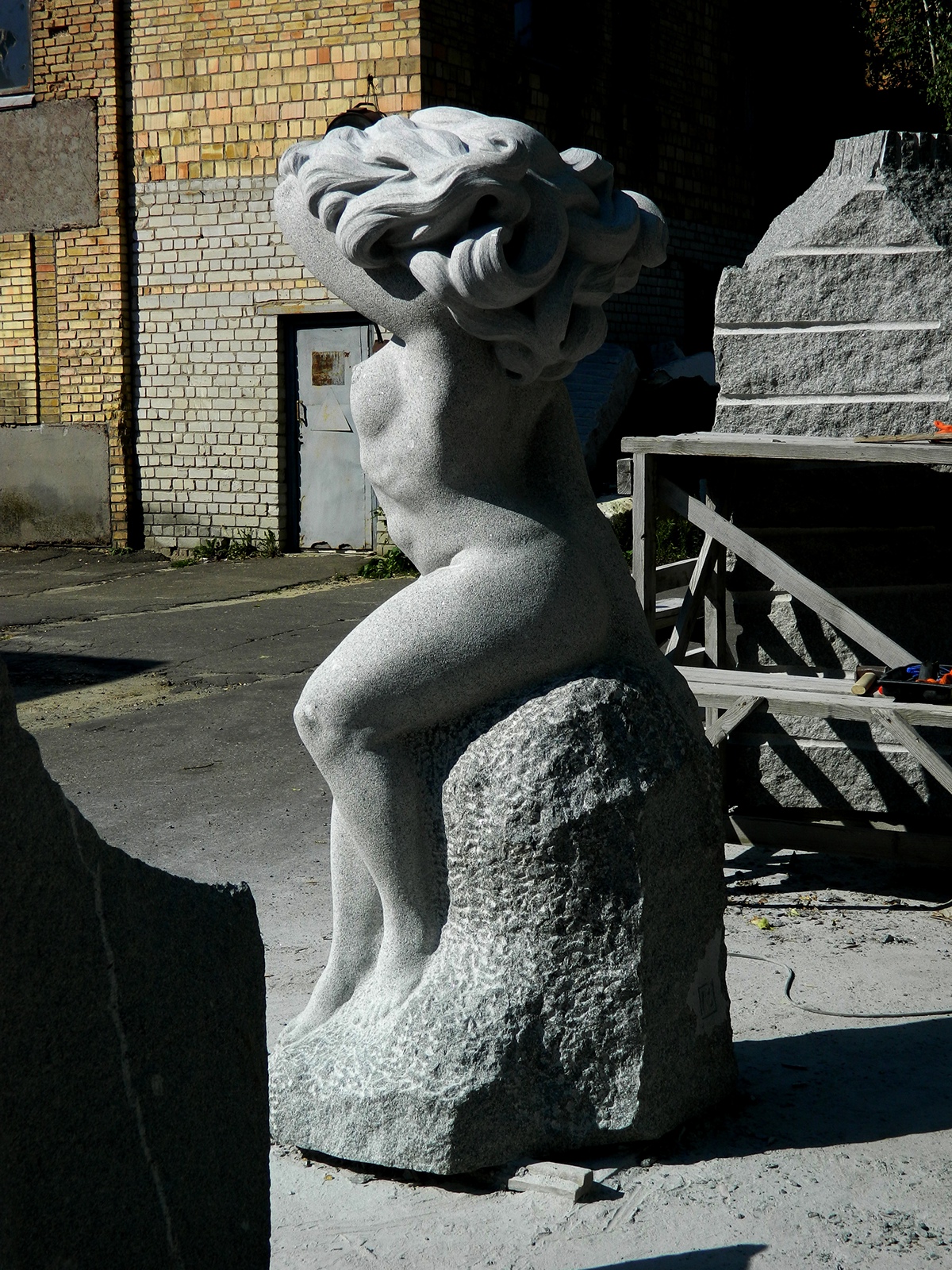 sculpture sculpting  woman rain body Granite stone sculptor monument