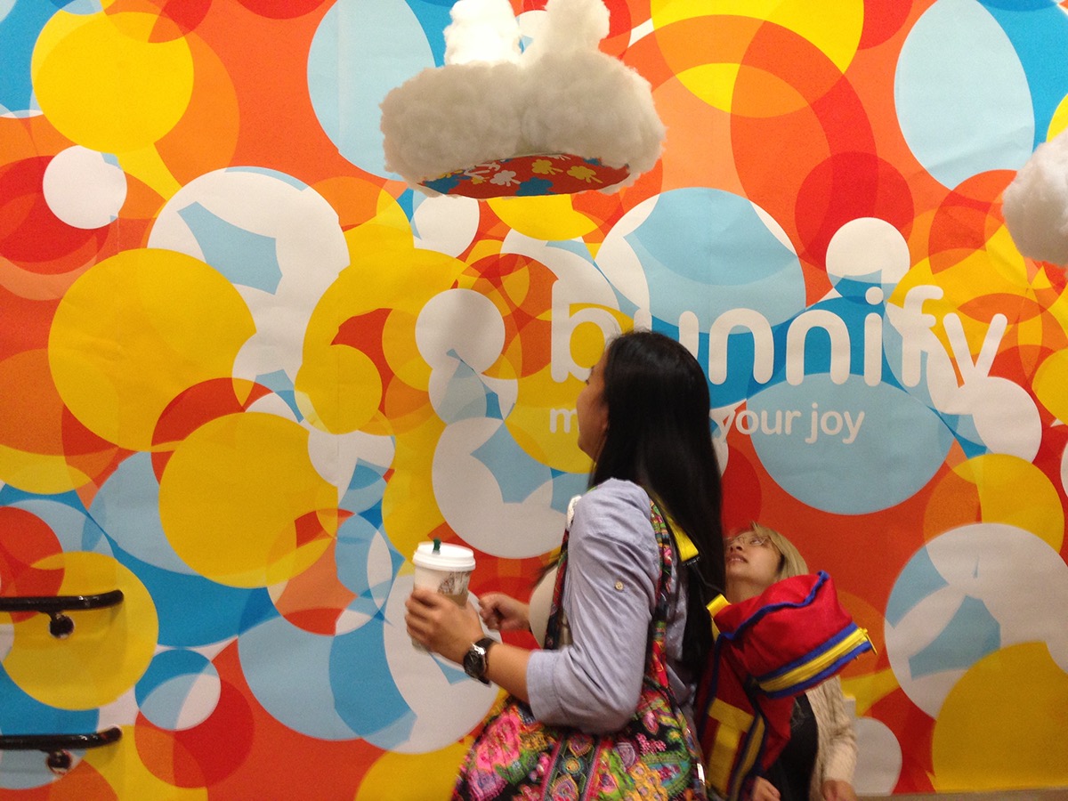 installation bunnify multiply your joy happiness colorful clouds big book