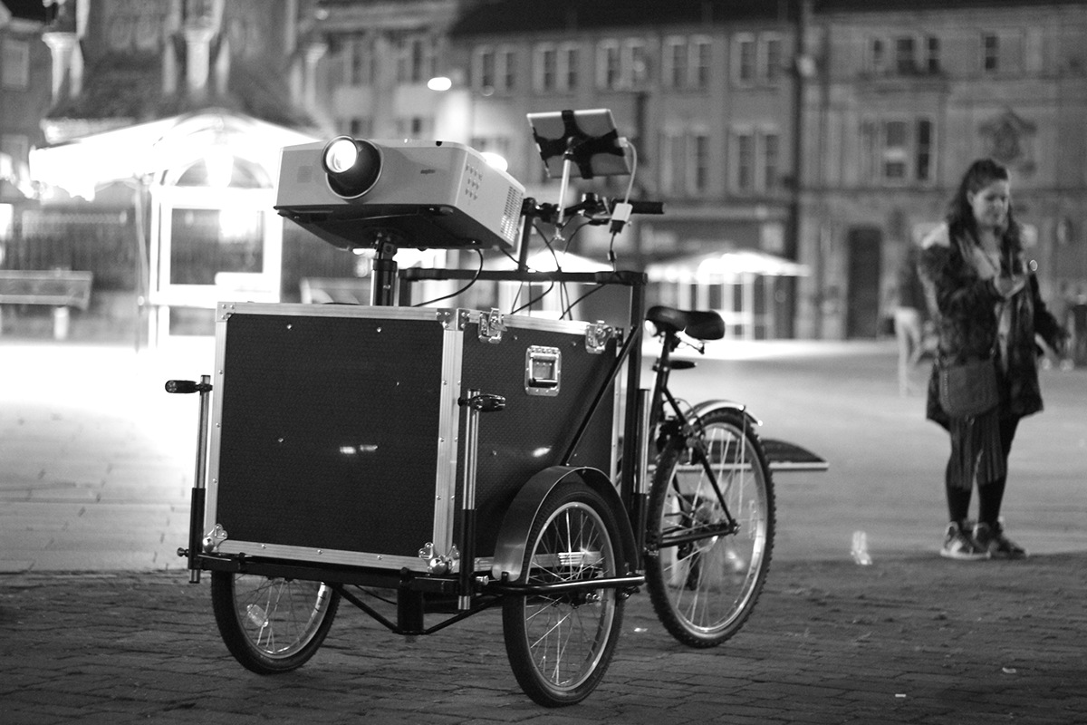 Urban Projections light cycle projection bike mobile projection Street projection guerilla projection