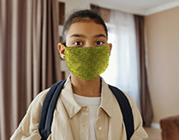 Little Girl Wearing a Face Mask [Free PSD Mockup]