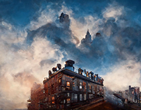 tenement buildings peak out of the top of the clouds,