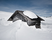 Snowbound shepherd huts in the Dolomites