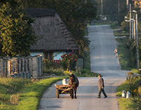 Traditional milk carrying in countryside. Poland.