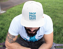 Embroidered Hat Mockup of a Guy Sitting in a Park