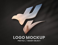 Logo mockup on grey wall Free Psd