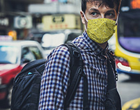 Man in Face Mask in City [Free PSD Mockup]