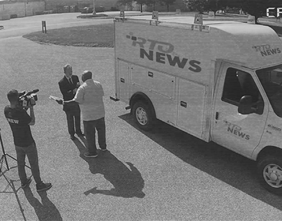 News team on security camera