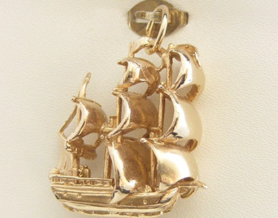 The solid gold Sail Ship Charm