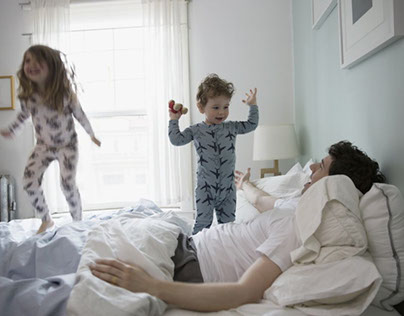 Kids jumping in bed