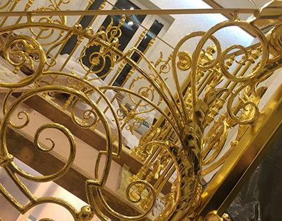 The gilded wrought-iron stair railings in private house