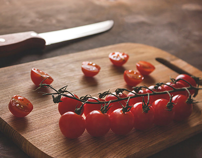cherry tomatoes on a cutting board