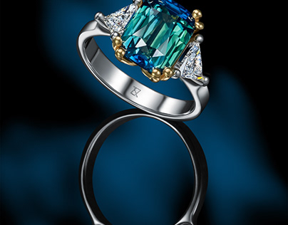 Teal sapphire and trillion diamonds in two colours gold