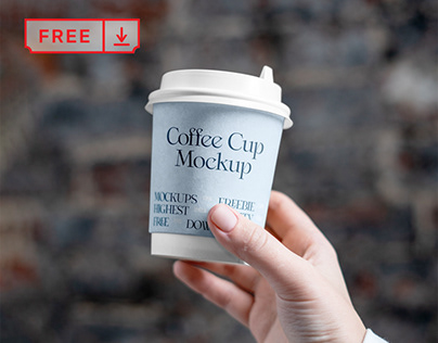 Free Coffee Cup in Hand Mockup