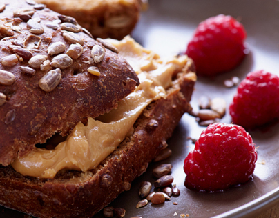 Whole grain bread with peanut butter and raspberry