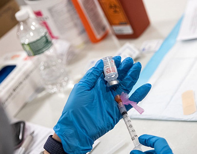 Healthcare worker preparing the vaccine