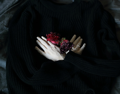 Hands on the chest and flowers on the hands
