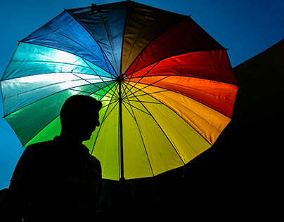 A man's colorful umbrella