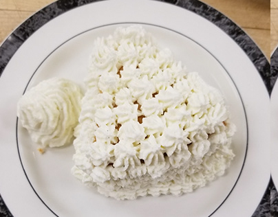 Slice of Angel Food Cake with Whipped Cream