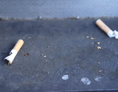 cigarette butts in the corners of city