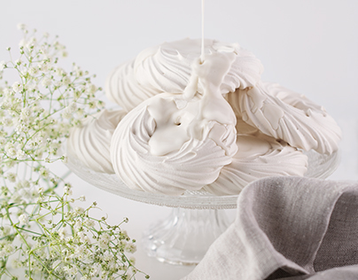 Meringues with Cream and White Baby's Breath Flowers