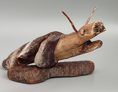 Snail figurine from driftwood