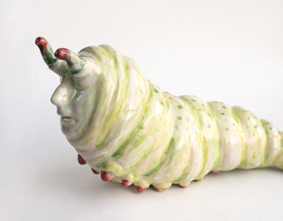 Ceramic Caterpillar with a human face