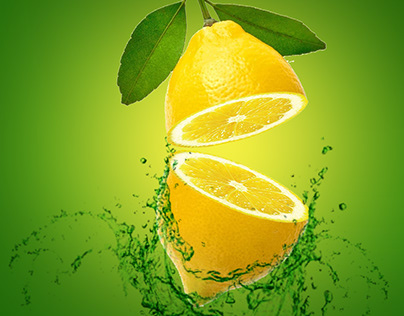 Water splashing on fresh sliced ripe lemons