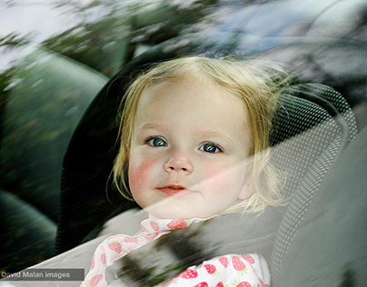 Girl in car seat.