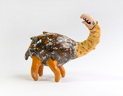 The creature with orange paws. Ceramic sculpture