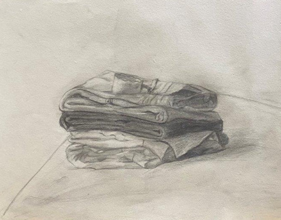 JOURNAL DRAWING: A Cup Placed On A Pile Of Clothes